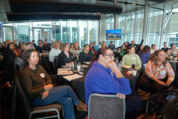 Workshop participants listening to panel speakers