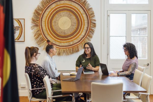 4 Indigenous researchers sitting at a table