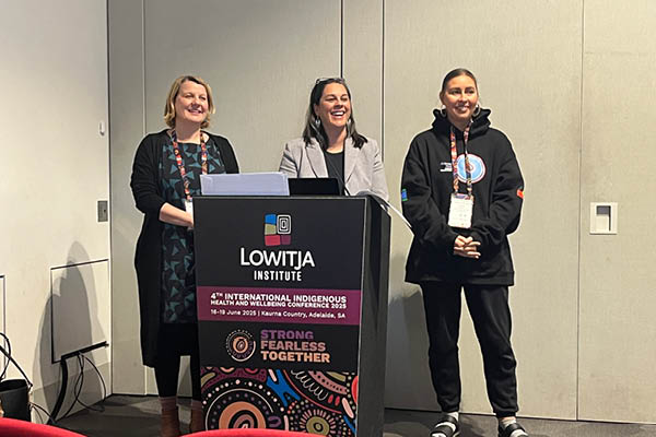 Odette, Shawana and Tahlia delivering conference presentation